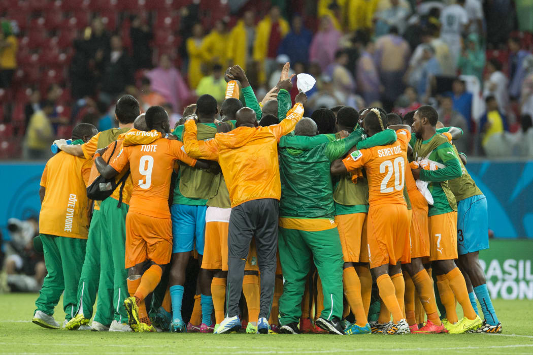 The Ivory Coast football team celebrates.