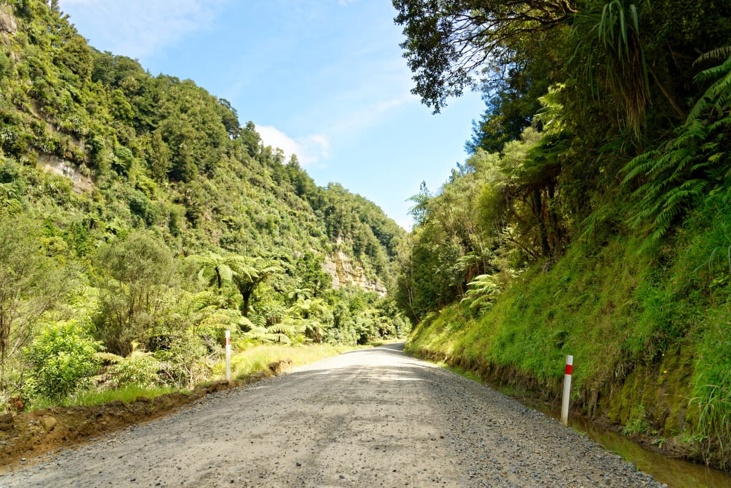 Lonely scenic highway through farmland in Taranaki, New Zealand