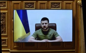 Ukrainian President Volodymyr Zelensky gives a speech to the French Parliament, 23 March 2022.
