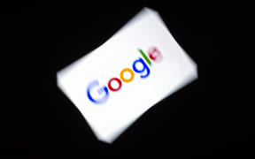 This illustration picture shows the Google logo displayed on a tablet