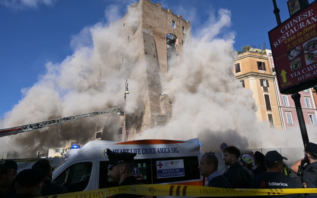 Dust rises due to a second collapse of part of the medieval tower "Torre dei Conti"  near the Roman Forum in the historic center of Rome on 3 November, 2025.