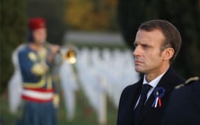 French President Emmanuel Macron stands at the cemetery by the Ossuary of Douaumont near Verdun, northeastern France.