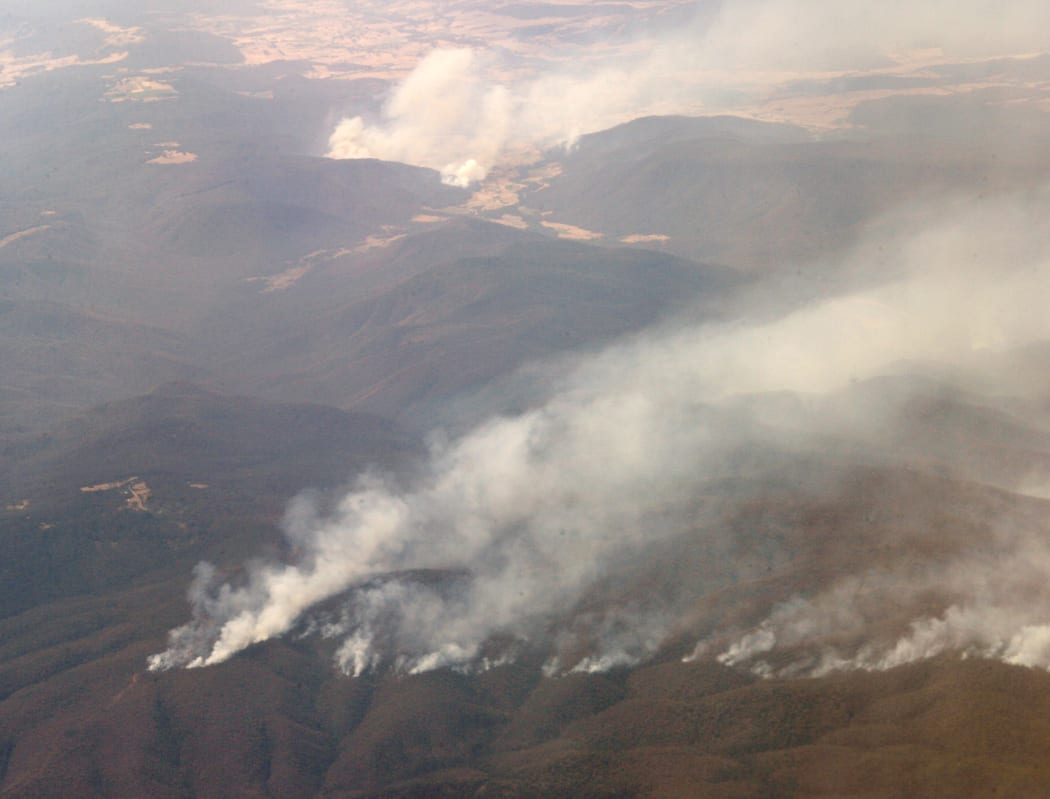 Bushfires snake through the hills in northern Victoria as more than 3000 firefighters battled some of Australia's worst wildfires in 70 years.