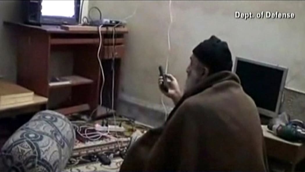 This framegrab from an undated video released by the US Department of Defense on May 7, 2011, reportedly show Al-Qaeda leader Osama bin Laden watching television at his compound in Abbottabad, Pakistan.