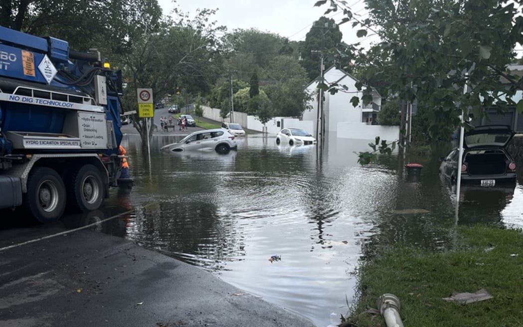 Kimberley Road, Epsom. Lots of cars have been caught in floodwaters and are waiting to be towed. 28 January, 2023