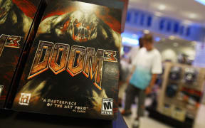 The video game "Doom 3" is displayed on a computer and game store shelf  04 August 2004 in New York City. "Doom 3", the $55 sequel,  hit stores nationwide 03 August and quickly sold out at many retailors. The game typifies the first person shooter genre pioneered in the early 1990s with the original "Doom," "Quake" and "Wolfenstein 3D" games.  (Spencer Platt/Getty Images/AFP) FOR NEWSPAPERS AND TV USE ONLY (Photo by Spencer Platt / Getty Images North America / Getty Images via AFP)