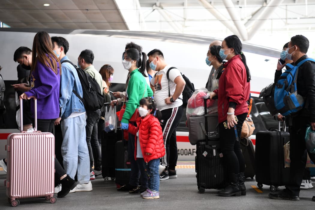 Passengers get off the high-speed train from Wuhan at Shenzhen North Railway Station in Shenzhen, south China's Guangdong Province, April 8, 2020.
