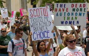 Abortion rights advocates gather and march outside the Hamilton County Courthouse after the Supreme Court overturned Roe v. Wade last week — ending a woman’s constitutional right to abortion which has been precedent and law for nearly 50 years. Saturday, July 2, 2022, in Cincinnati, Ohio, USA. (Photo by Jason Whitman/NurPhoto) (Photo by Jason Whitman / NurPhoto / NurPhoto via AFP)