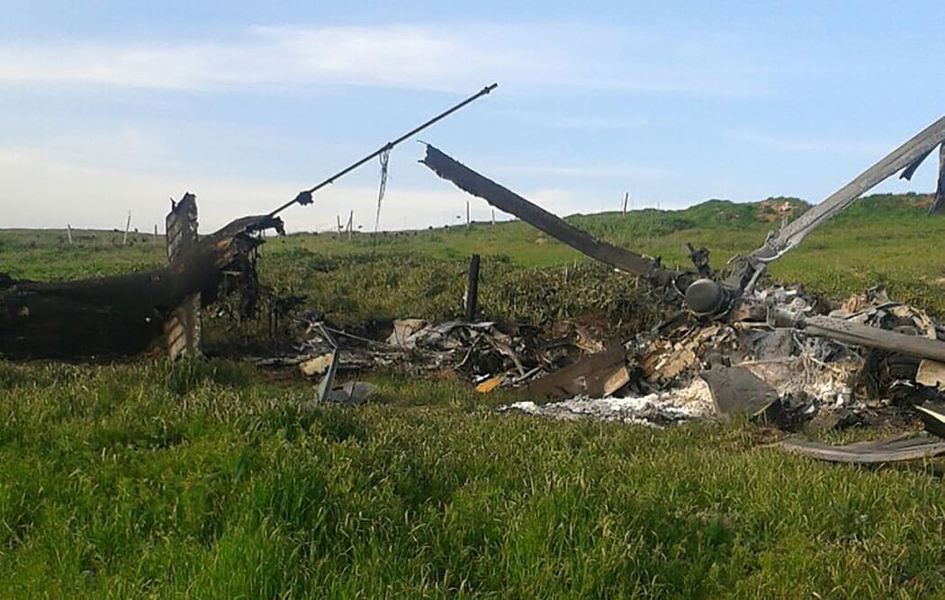This image is reported to show the remains of Azerbaijan's downed Mi-24 helicopter in a field in the Armenian-seized Azerbaijani region of Nagorny-Karabakh.