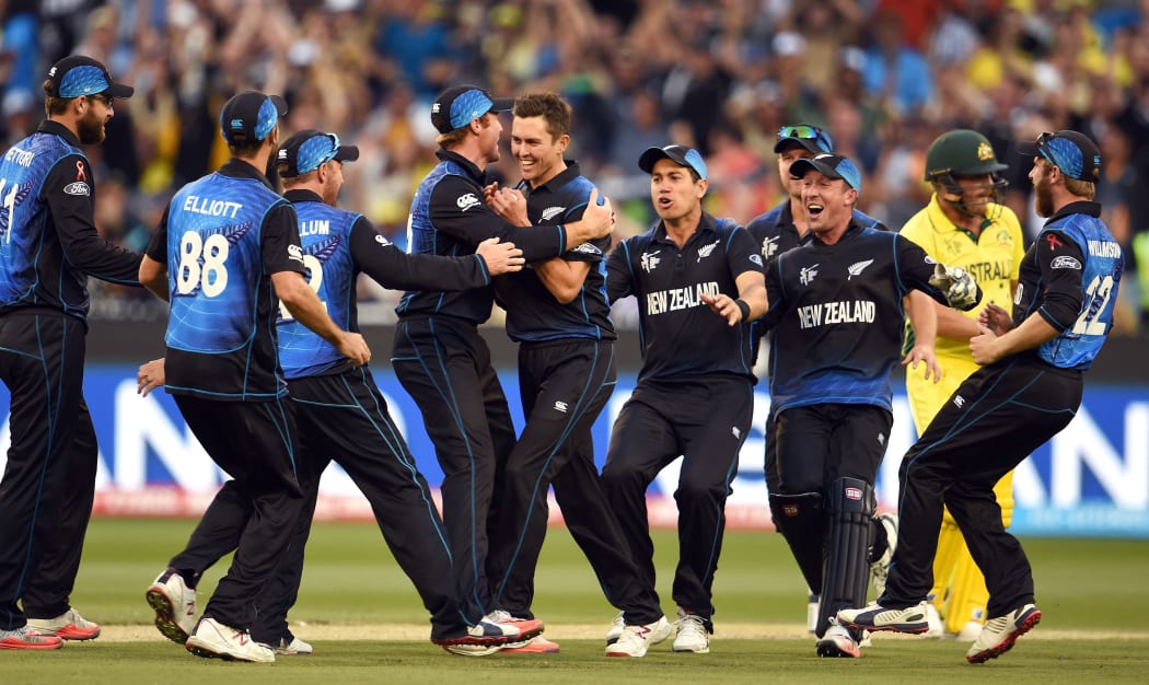 New Zealand fast bowler Trent Boult (C) is congratulated after dismissing Australia's Aaron Finch.