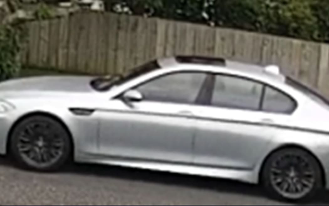 A silver 2013 BMW M5.