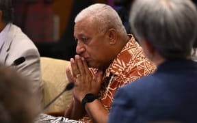 Fiji Prime Minister Frank Bainimarama (C) speaks at the opening remarks of Pacific Islands Forum (PIF) in Suva on July 12, 2022 (Photo by William WEST / AFP)