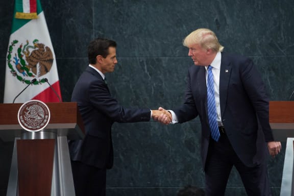 US Republican Presidential candidate Donald Trump, right, meets with Mexican President Enrique Pena Nieto.