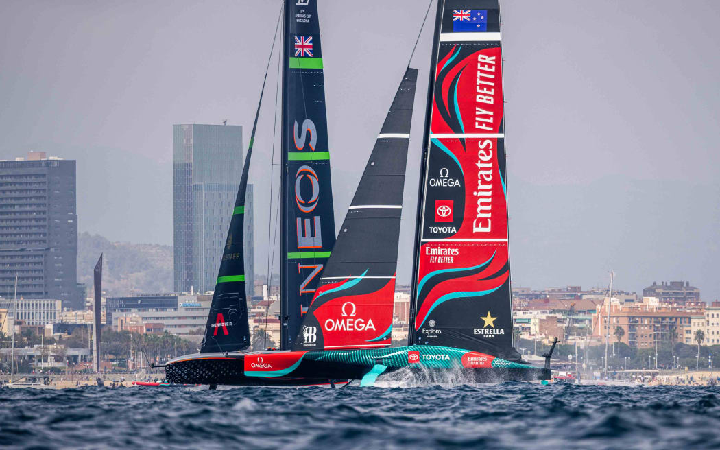 Ineos Britannia and Emirates Team New Zealand getting close as ETNZ win a penalty against Ineos in the pre-start of race three at the Louis Vuitton 37th America’s Cup in Barcelona.