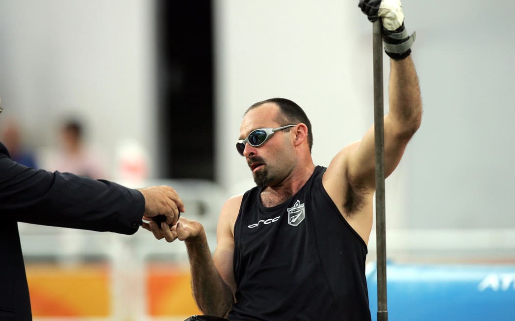 Peter Martin competes in the men's F52 shot put final at the Olympic Stadium in Athens, Greece, Wednesday, September 22, 2004. Martin won the gold medal with a world record of 9.34 meters. Photo: Hannah Johnston/PHOTOSPORT