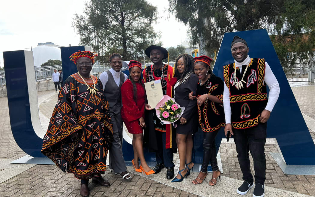 image of Bernard Sama and his family, Phd graduation