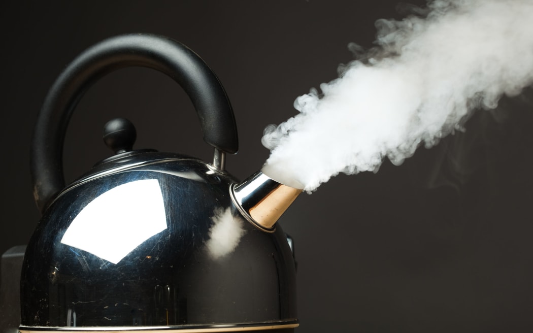 boiling kettle with dense steam