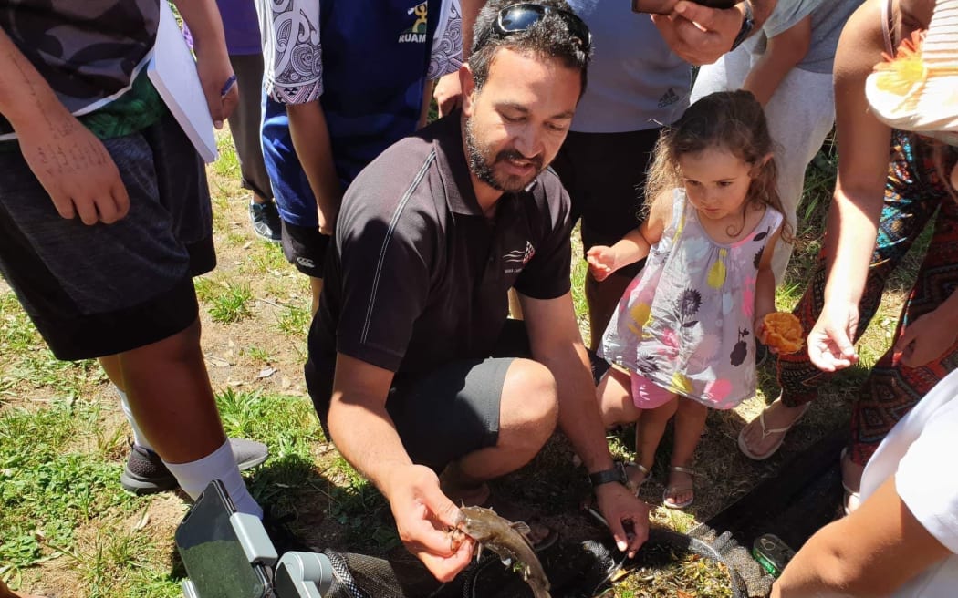 William Anaru, Te Arawa Lakes Trust, holding catfish