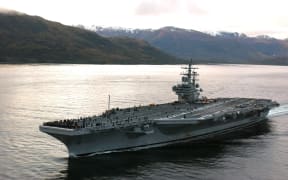 The USS Ronald Reagan cruises through the Straits of Magellan on her way to the Pacific Ocean.
