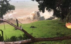 Barge stuck on the rocks behind a B&B on Great Barrier Island.