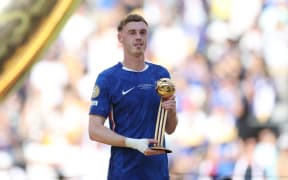 Chelsea's English midfielder Cole Palmer poses with the Golden Ball trophy during the award ceremony for the FIFA Club World Cup 2025 champions.