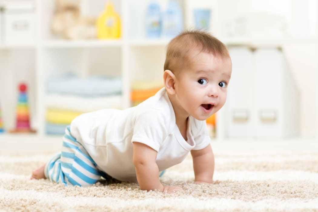 Crawling baby at home.