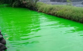The river at Arue went fluorescent green.