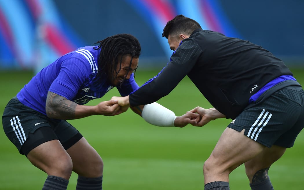 Ma'a Nonu and Sonny Bill Williams stretch during a training session at the Lensbury Hotel in Teddington.