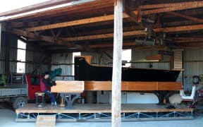 Adrian Mann and his long piano