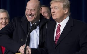 US President Donald Trump shakes hands with Gary Cohn, Director of the National Economic Council.