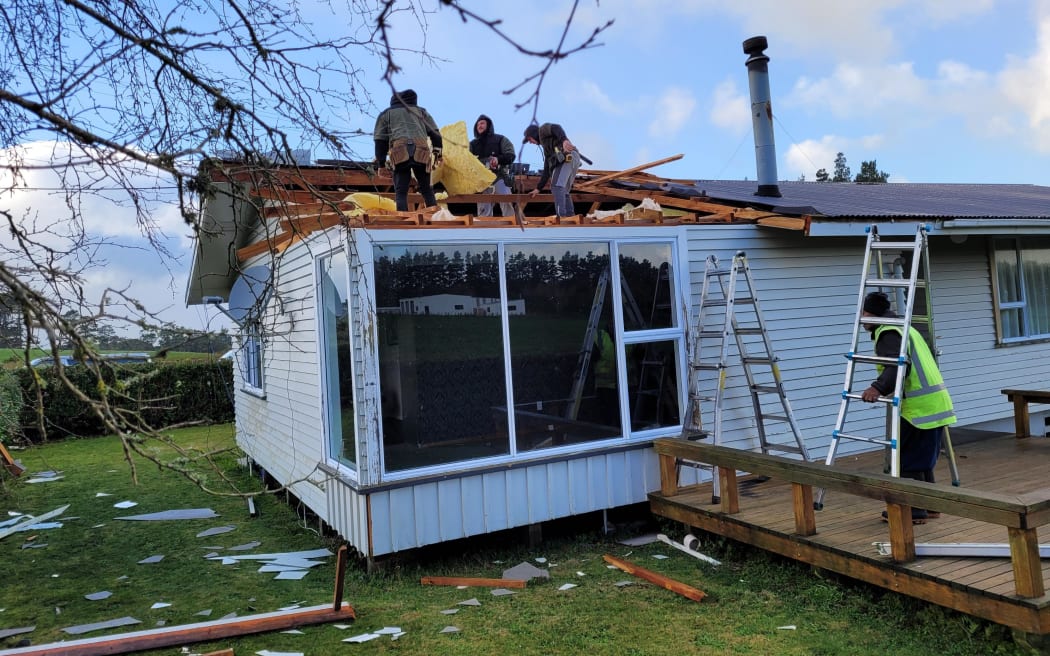 Clean-up continues on Kaponga dairy farmer Shelley Pope's property after overnight storms.