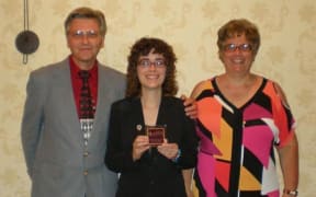 Axton Betxz-Hamilton and her Mum at award ceremony for her work on identity theft