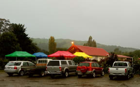 Colourful tents in front of the wharenui at Hiruharama Marae near Ruatorea, as it prepares to hold a tangi for Whairiri Ngata.