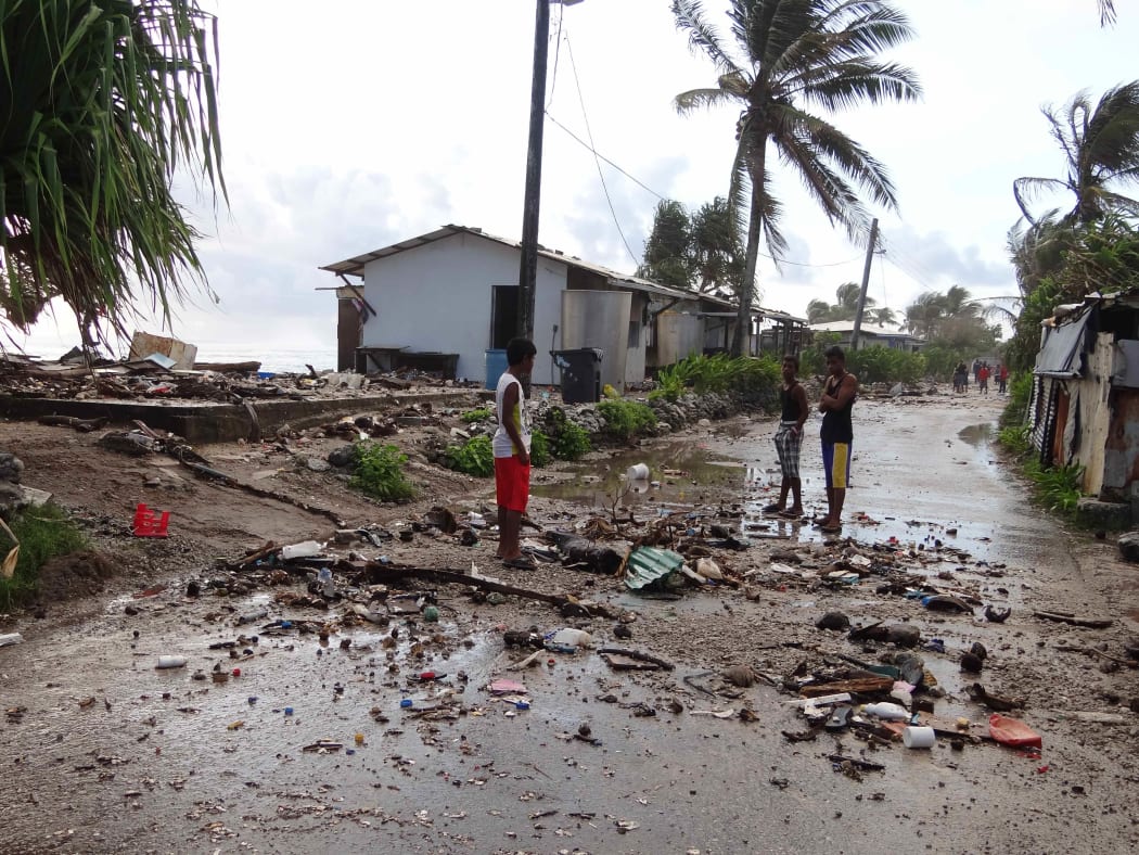 Majuro residents amid the debris from an ocean inundation in 2014