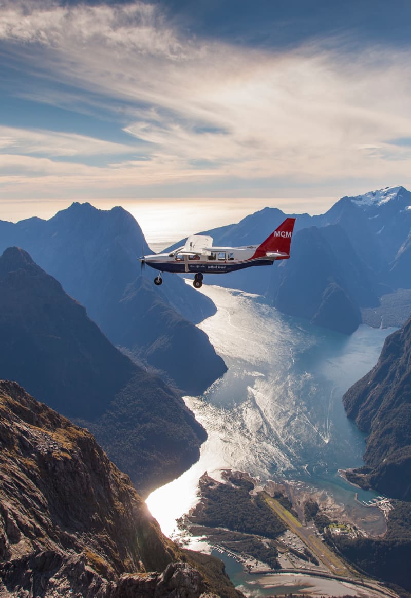 Small Airvan plane over Milford Sound.