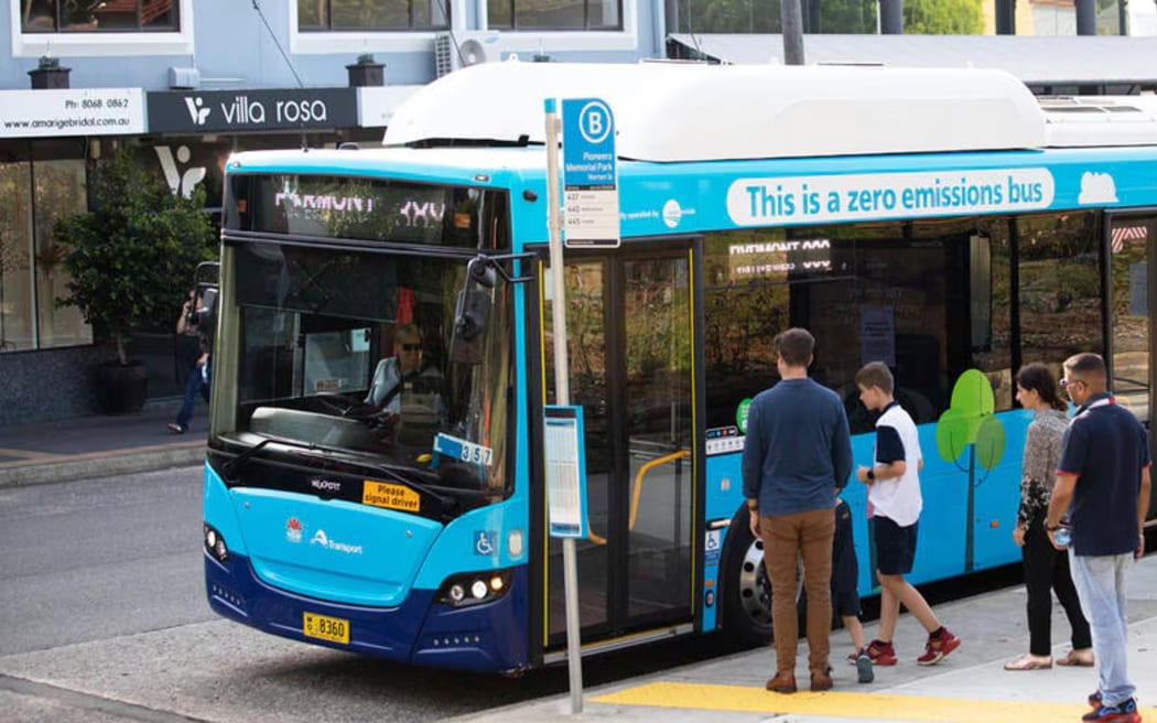 People getting on a bus