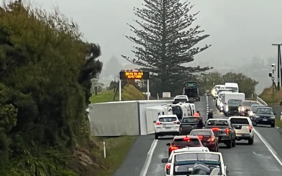 A truck on its side on SH1 heading north before Kaiwaka