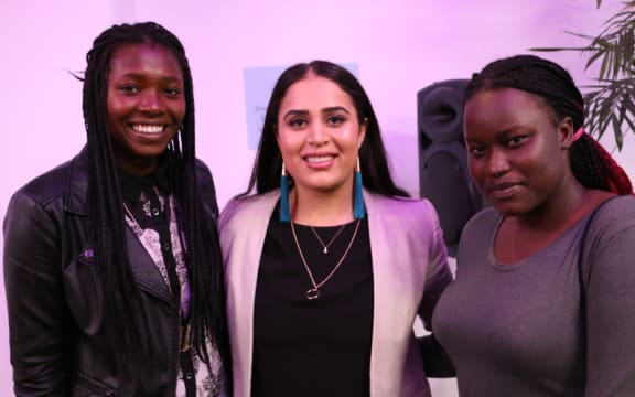 Rez Gardi (centre) and two former refugees who support her charity Empower