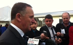 John Key speaking to reporters in Christchurch on Thursday.