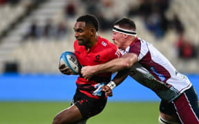 Sevu Reece of the Crusaders is tackled by Ryan Smith of the Reds during the Super Rugby Pacific match, Crusaders Vs Reds, at the Apollo Projects Stadium, Christchurch, New Zealand, 4th May 2024. Copyright photo: John Davidson / www.photosport.nz