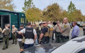 Santa Clarita Valley branch sheriffs gather near Saugus High School where a shooting has taken place.