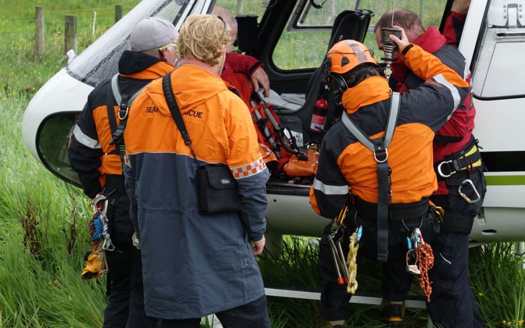 The alpine cliff recovery team prepare to fly into Fox glacier.