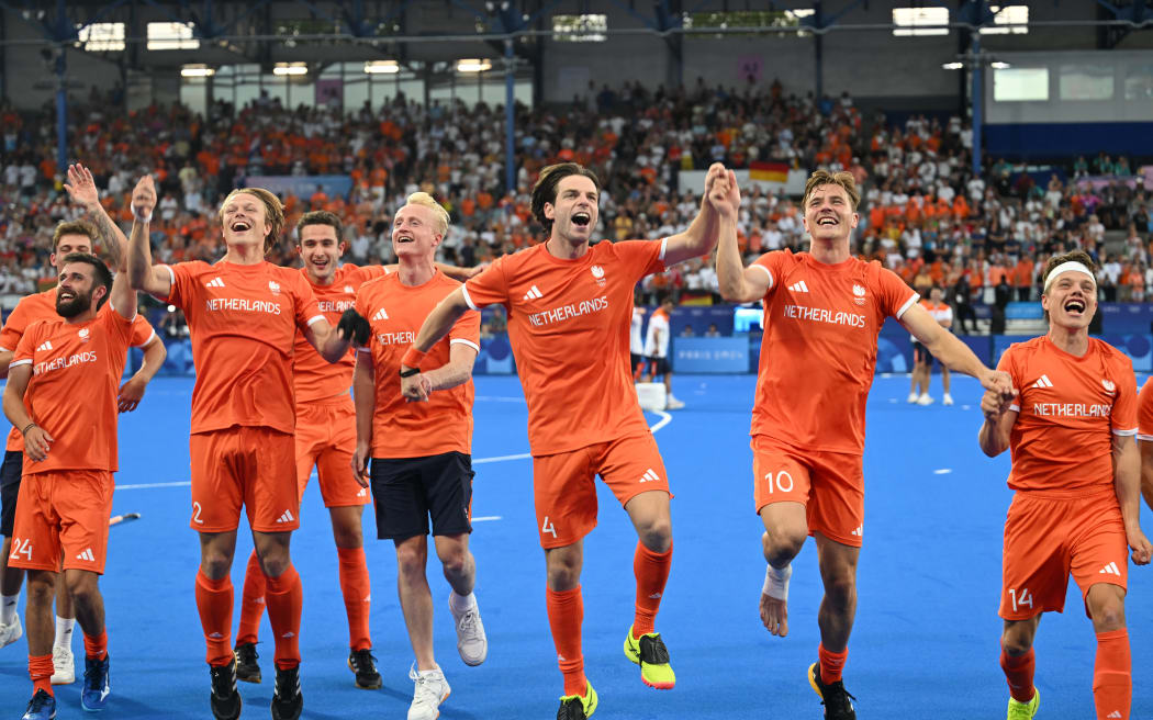 Netherlands players celebrate winning the men's hockey final at the Paris Olympics.