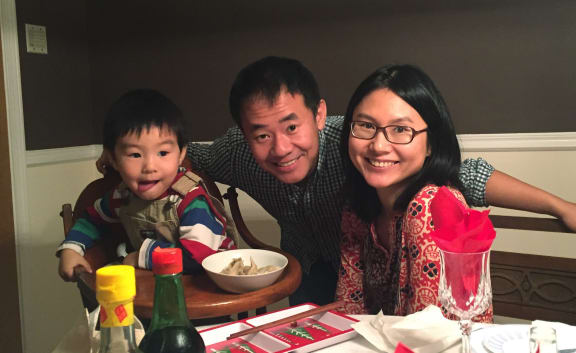 Xiyue Wang (C) with his wife and their son before he was detained in Iran in August 2016.