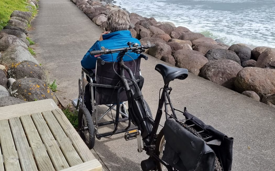 Kevin Harvey's e-bike wheelchair invention with his wife Bev in the front.