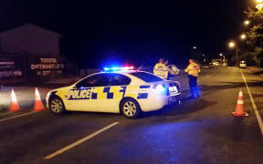 Police at the scene of the homicide investigation in Taita.