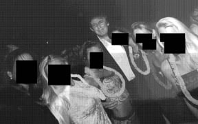 Trump poses with a group of women. The women's faces were redacted by Democrats on the House Oversight Committee. House Oversight Democrats