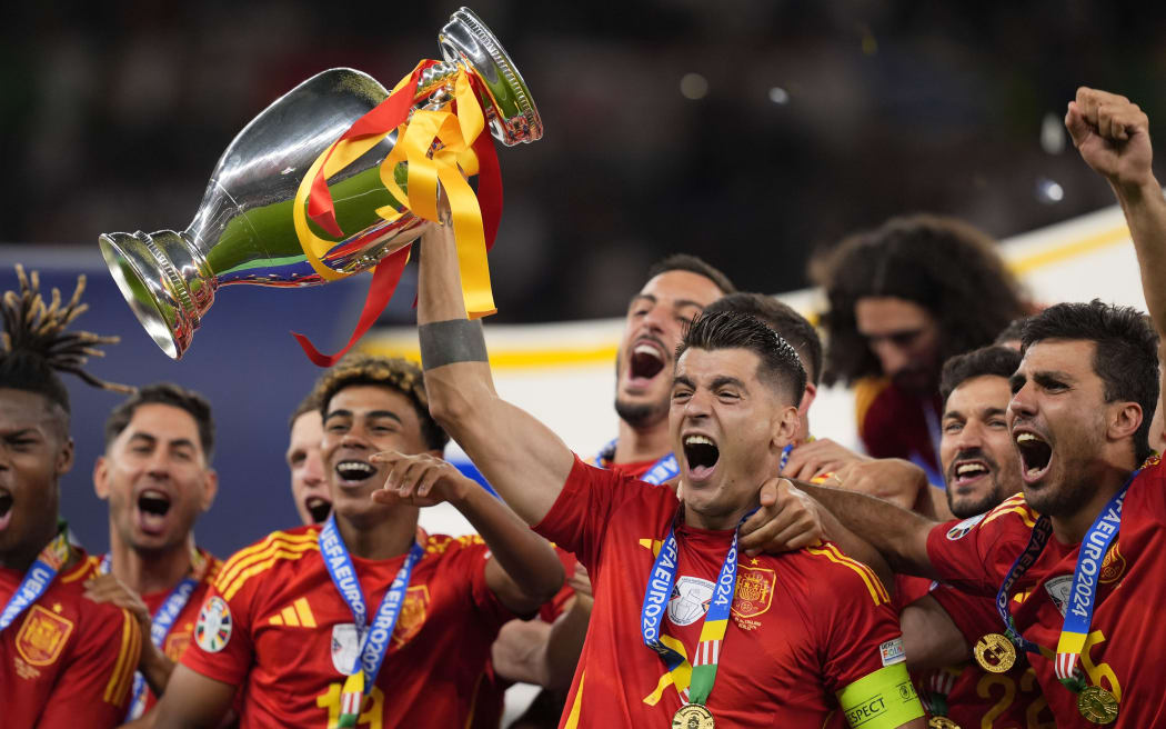 Spain's Alvaro Morata vith the trophy after the Euro2024 final between Spain and England.
