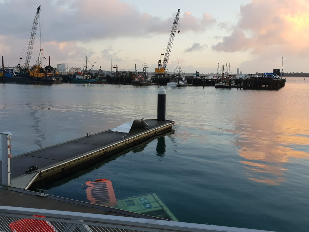 The Auckland waterfront on Tuesday morning after a wind blast being described as a tornado sent a ferry adrift, and blew shipping containers into the sea.