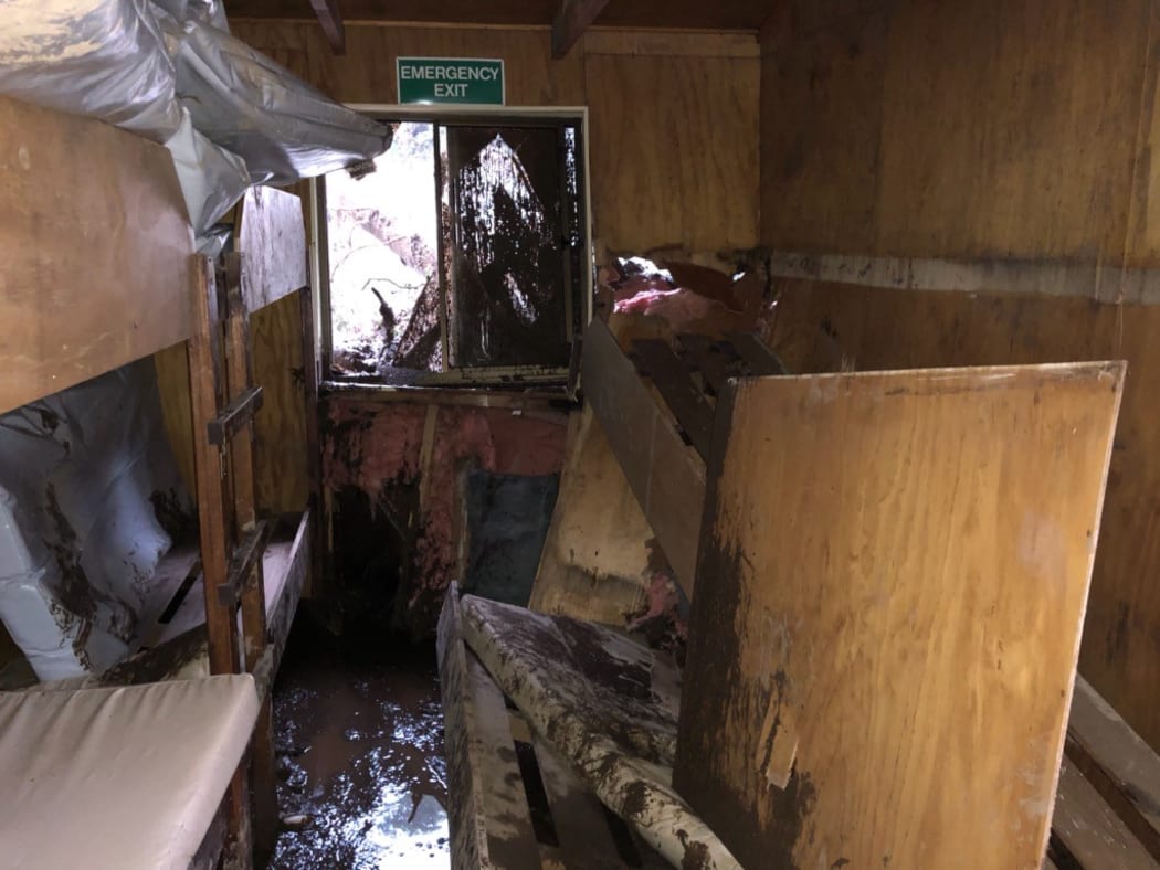 A land slip in torrential rain smashed through the Howden hut on the Routeburn track on Tuesday morning.